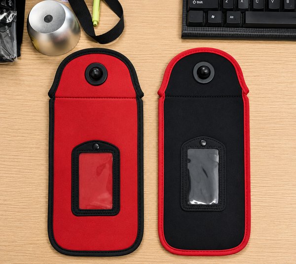 Close-up of the clear ID window on red and black PhoneLock pouches